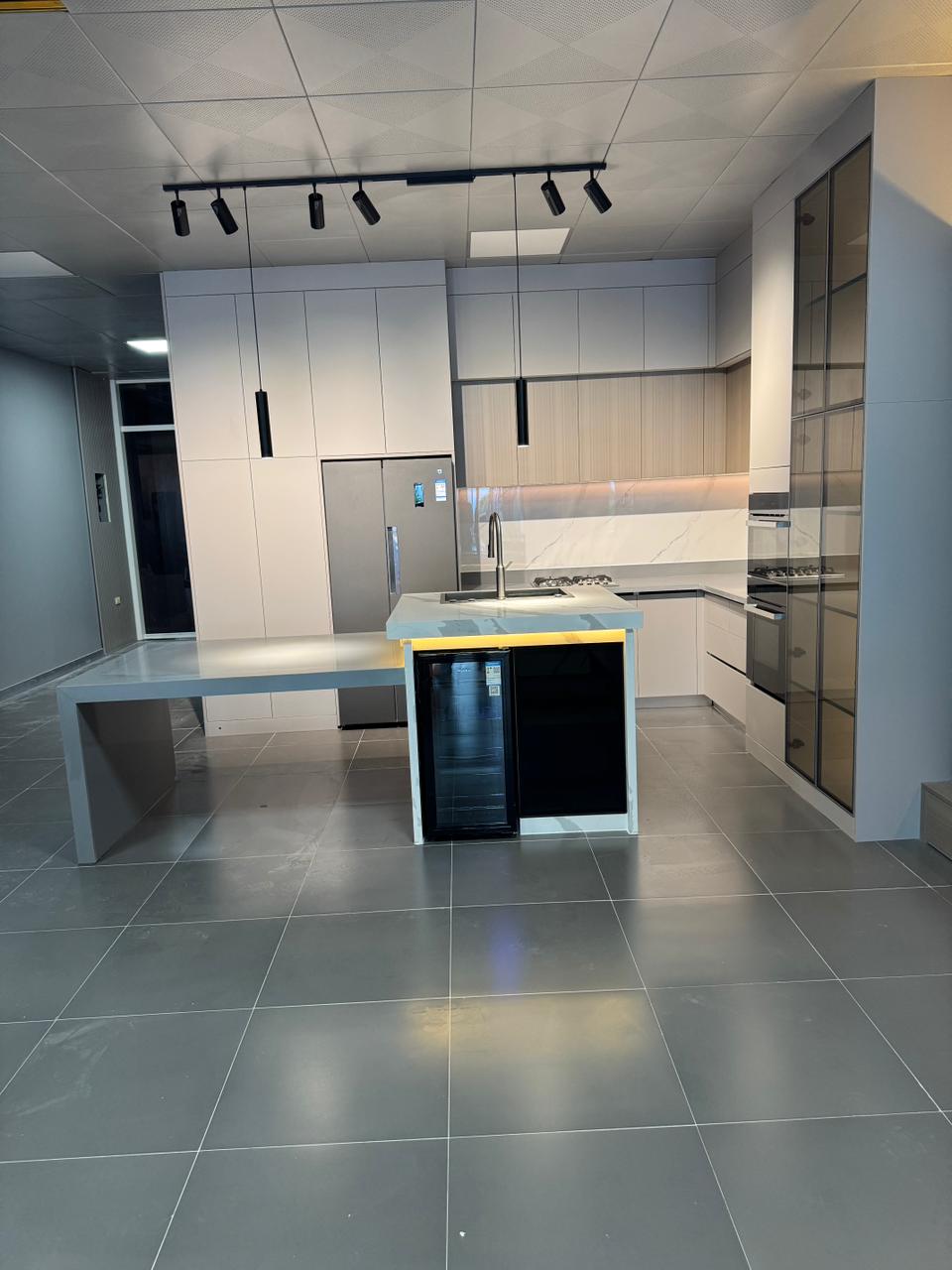 Custom kitchen island with quartz countertop built and installed by Dream House Cabinet