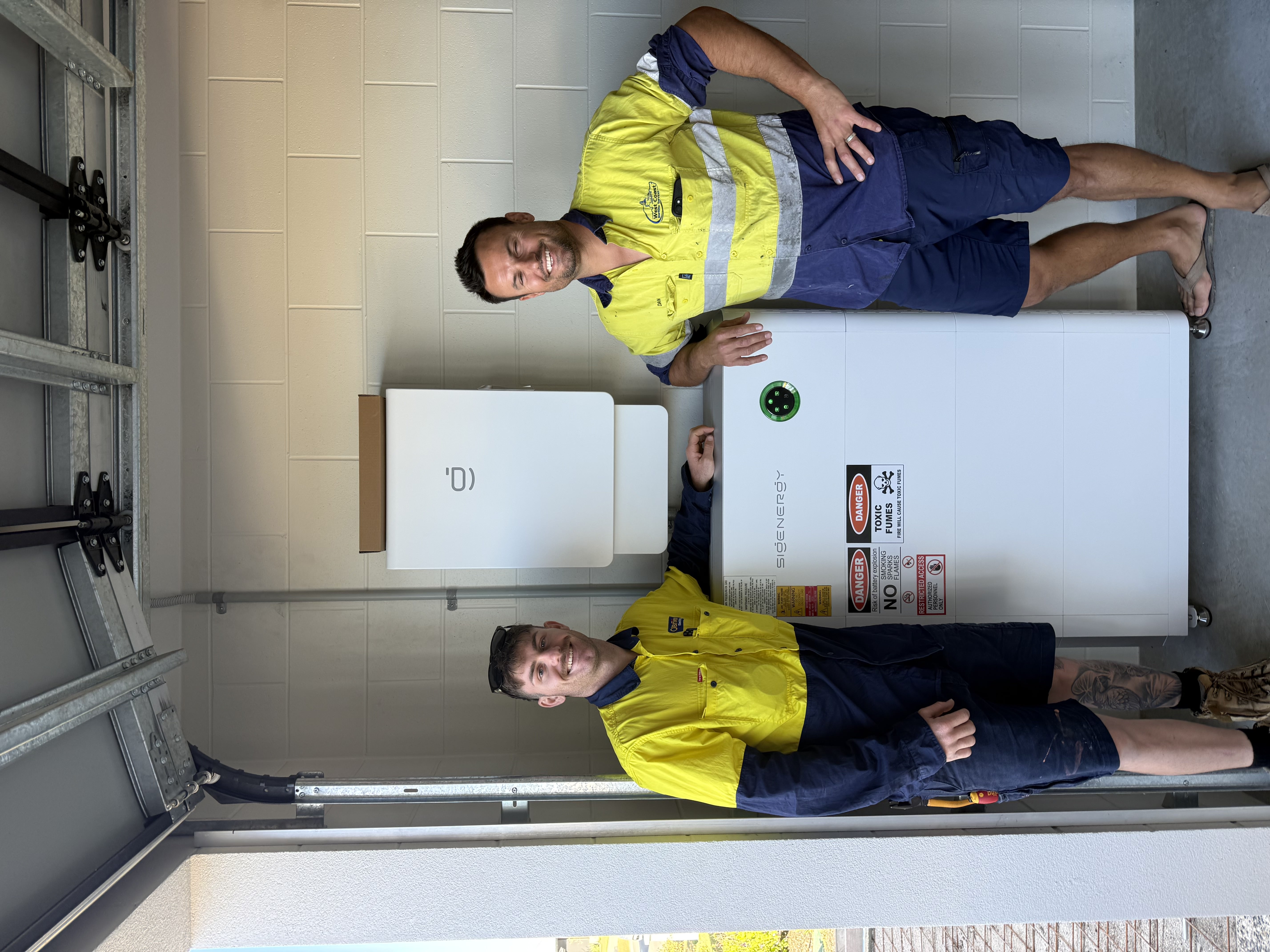 O'Brien technicians with a SIG Energy battery
