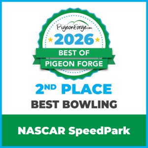 Go-karts lined up and racing at NASCAR SpeedPark
