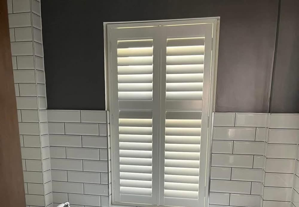 Waterproof shutters in a tiled bathroom