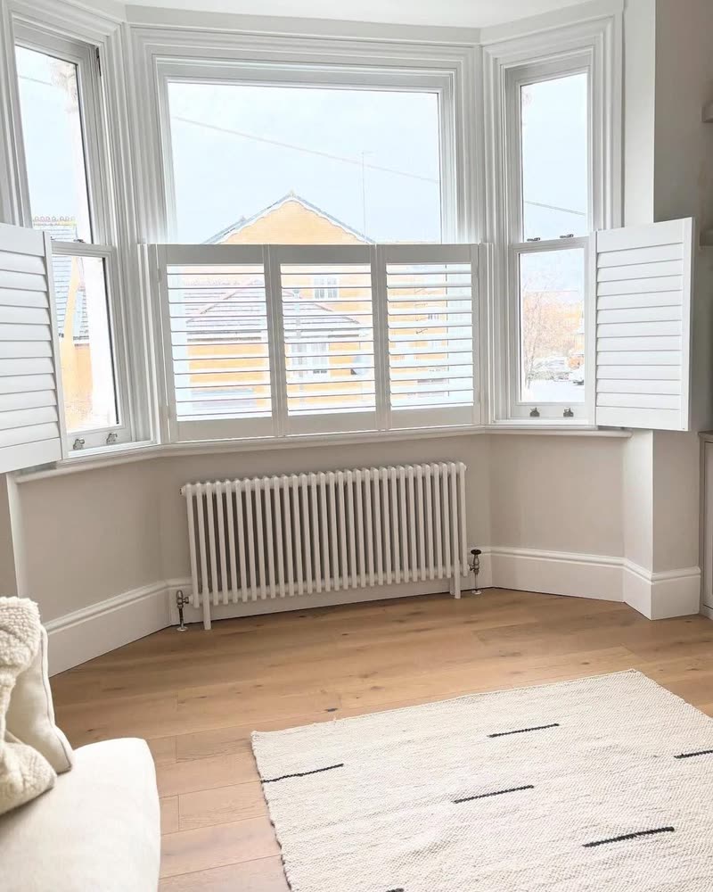 Café style shutters in a period bay window