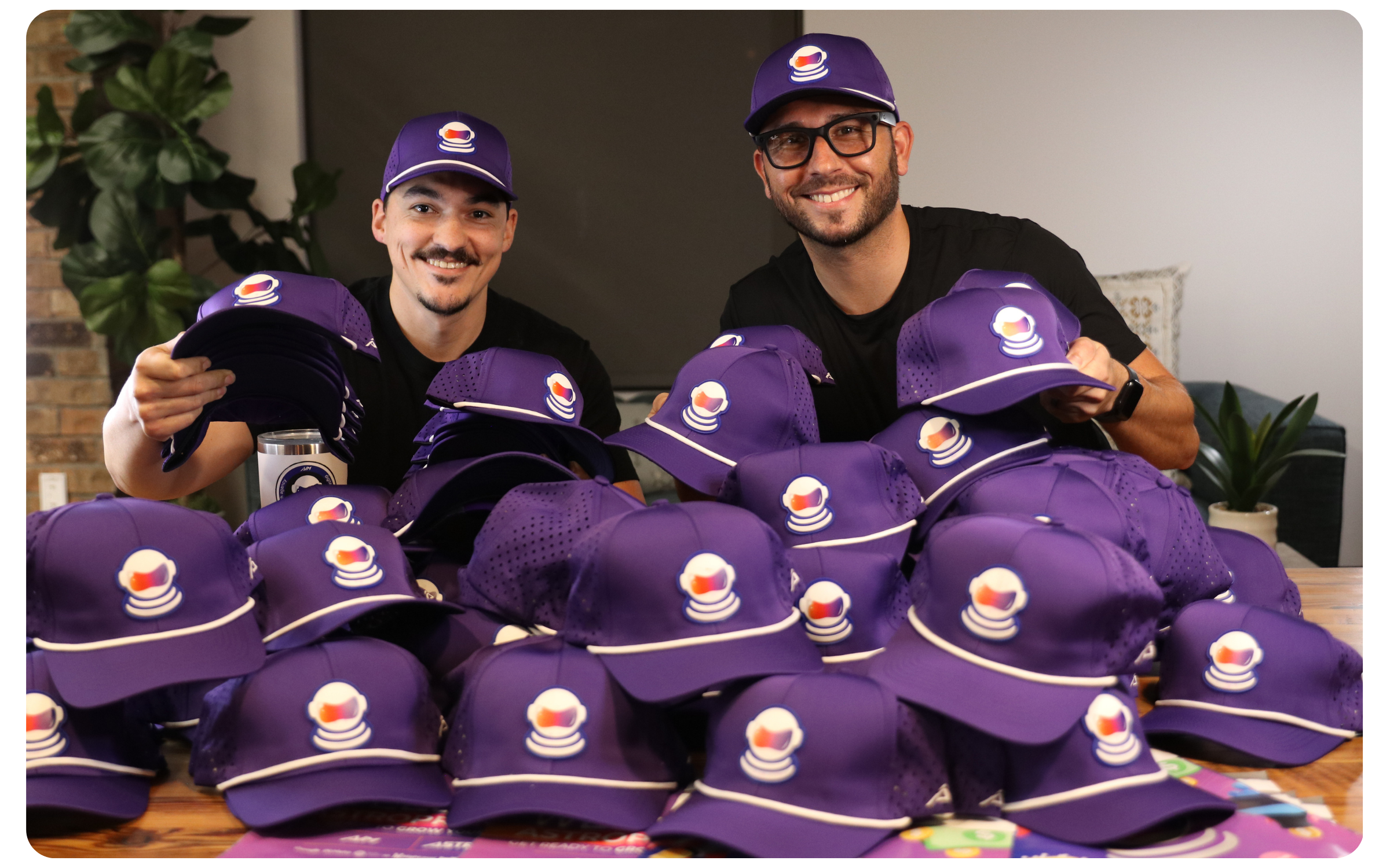  Our founders wearing signature purple hats, an exclusive gift for AIM Marketing clients, specializing in lead generation and advertising for home service businesses.