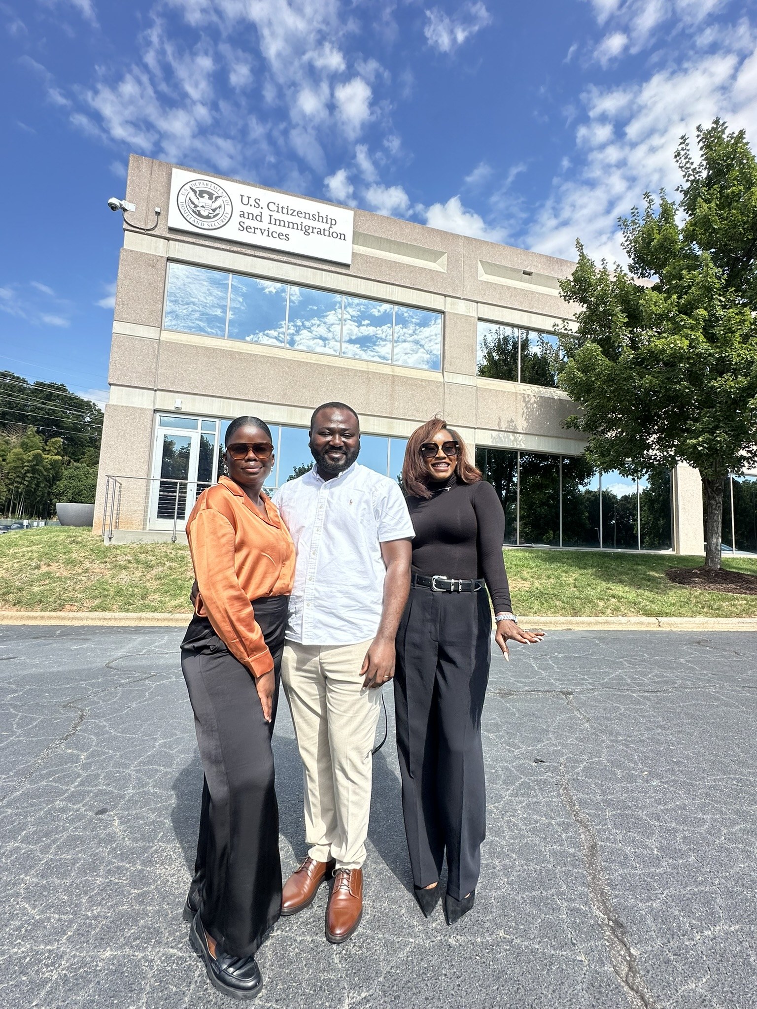 Attorney Ify with clients outside the USCIS Charlotte Field Office