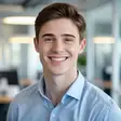 Headshot of a friendly young man smiling in a cozy home office for Alex M. testimonial