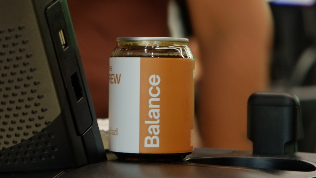 Scarab Coffee cold brew bottle positioned as a fitness-focused beverage in a Dubai gym