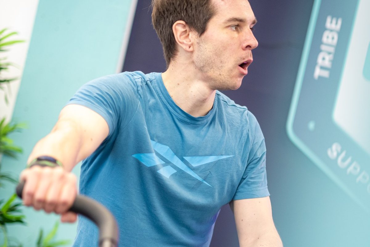 A member pushing hard on the bike