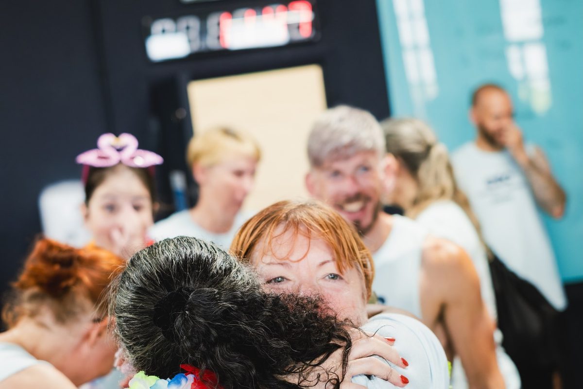 Two members hugging after a workout
