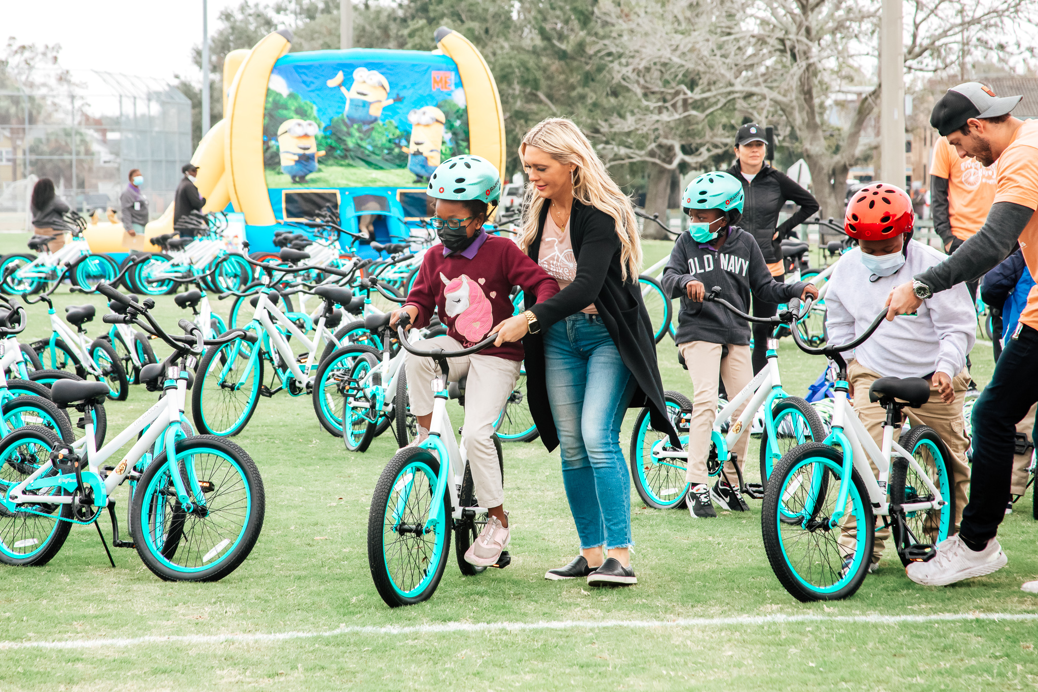 Katie Blomquist with kids at a Going Places bike reveal