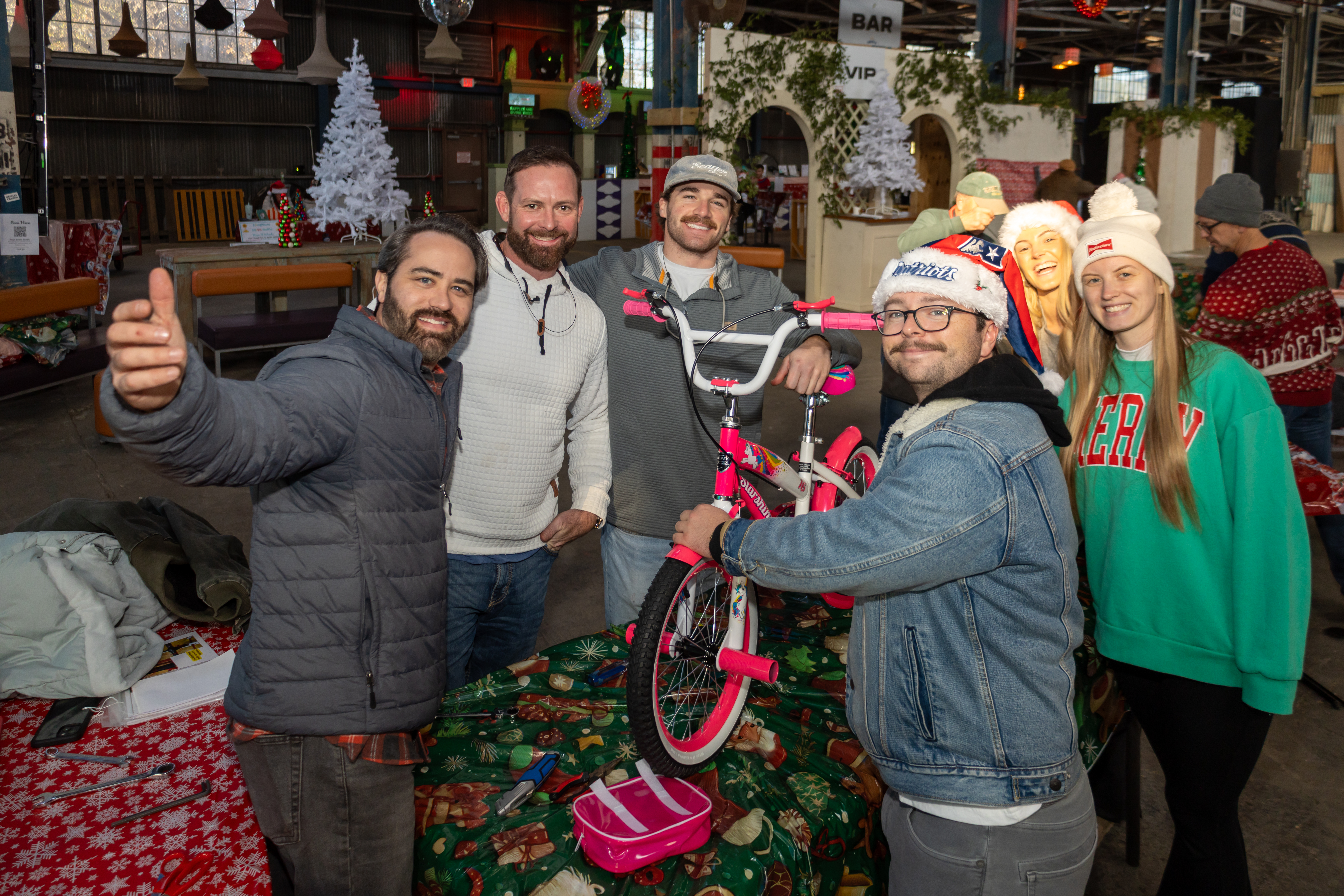 A team from a Charleston business building bikes together at the Bike Build