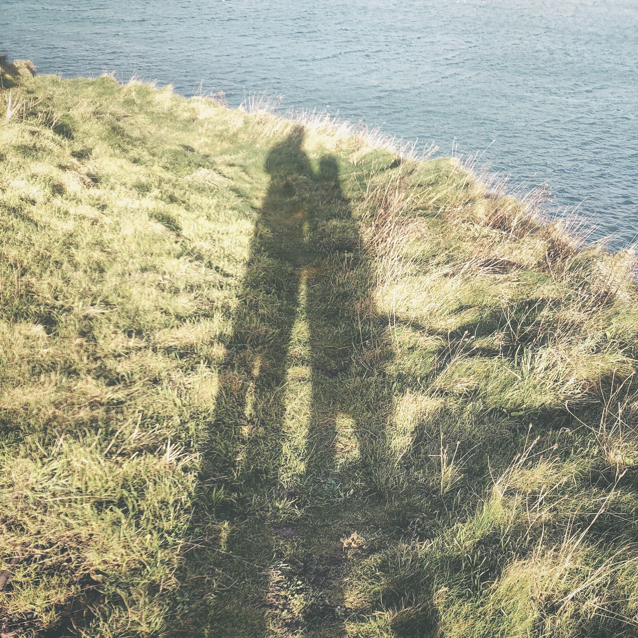 'Mine and my Mums silhouettes on a hill by the sea we often used to walk’
