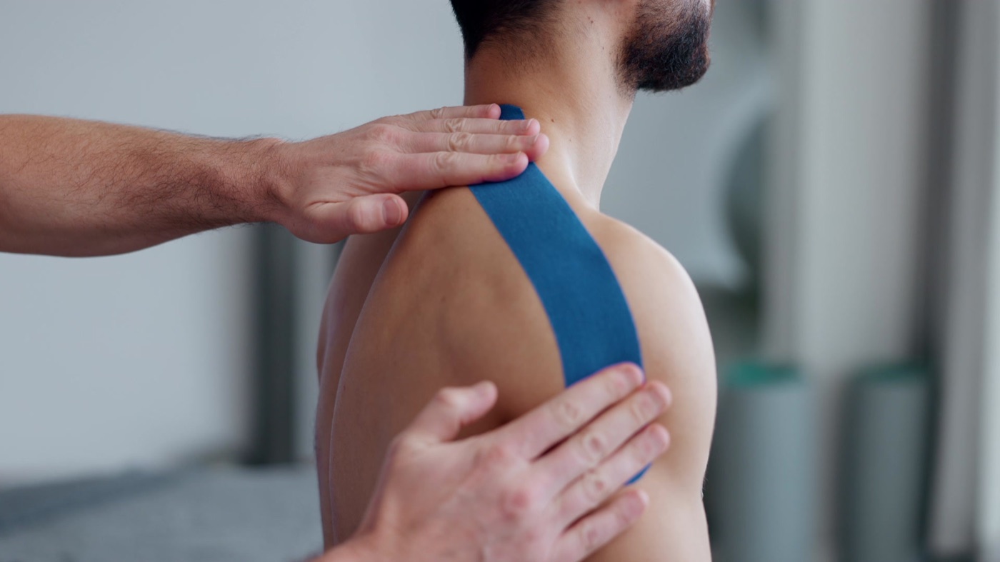 Physiotherapist treating a patient's shoulder