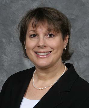 Potrait Image of Karen Botnick Paz in a black office attire smiling