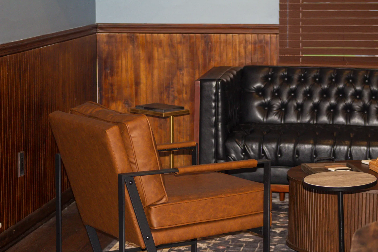 Leather chair and tufted couch