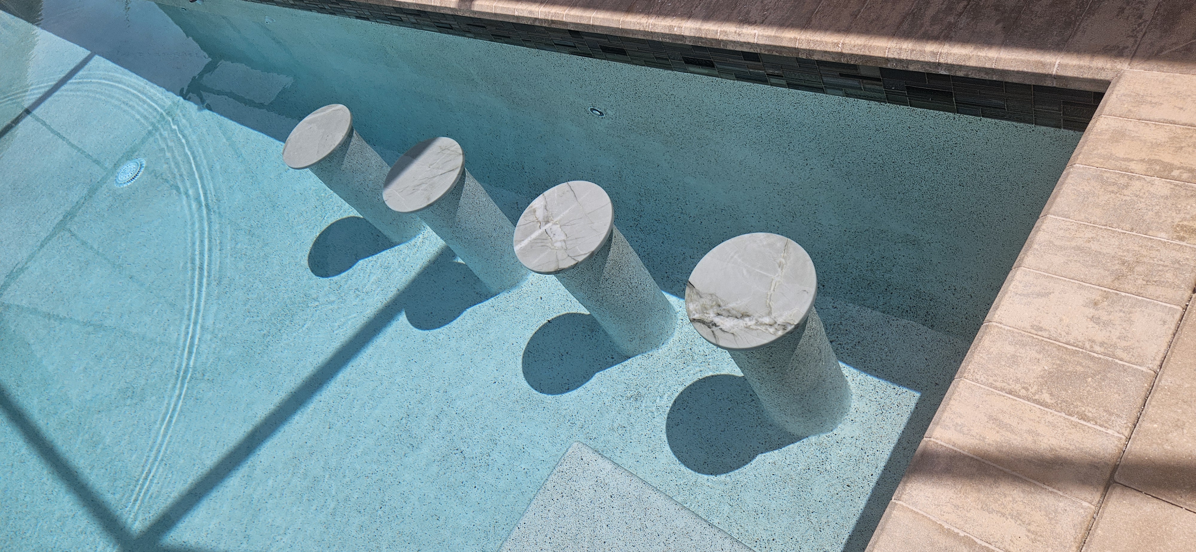 Premium coping and decorative tile detail by Design Concepts
