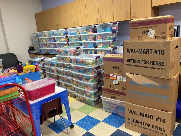 Foundation volunteers stocking the supply room