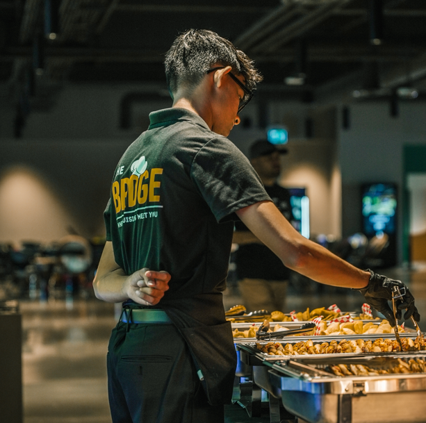 Staff of The BRDGE serving food at TEDX event