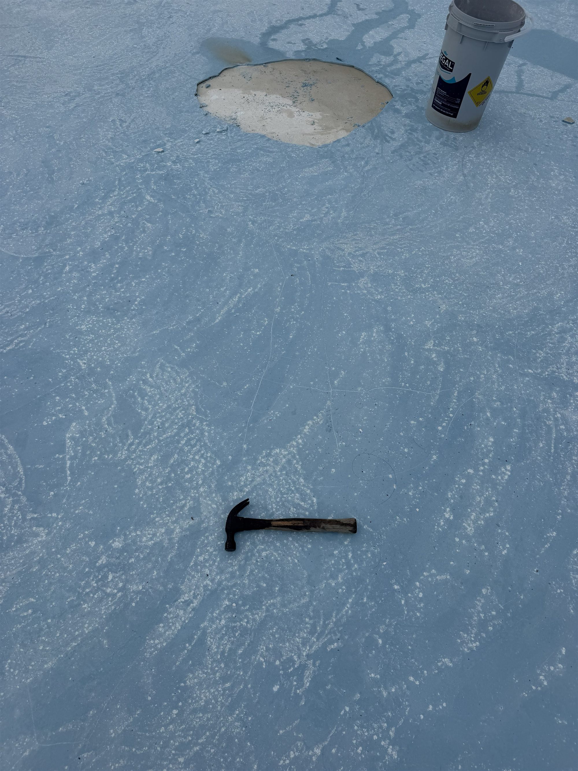 The call was about this — a bare patch opening up in the floor of a community pool