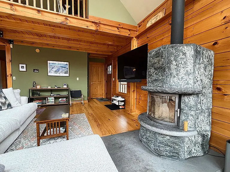 Living room with Tulikivi Finnish soapstone fireplace