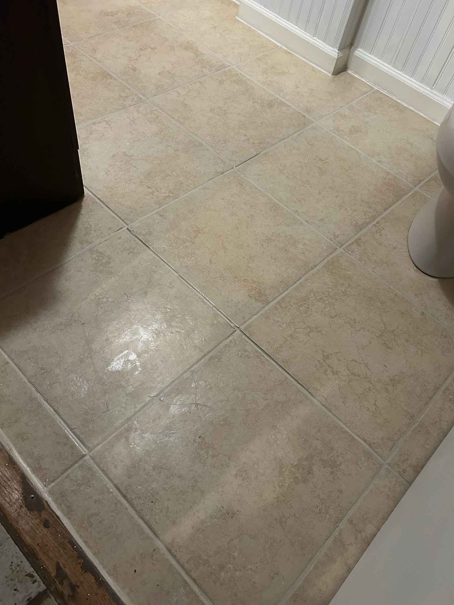 Same bathroom floor with uniformly clean sealed grout