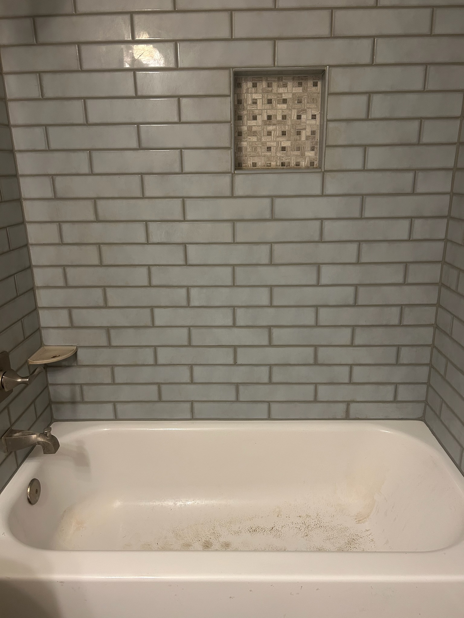 After: Severely damaged shower fully restored by American Grout and Tile
