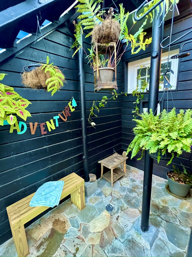 Outdoor shower among the greenery