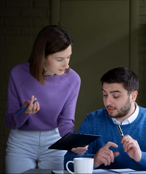 Female and male co ordinator working together on a project