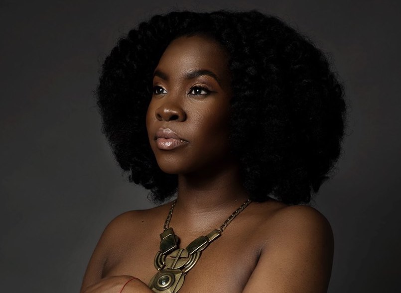 Portrait with natural textured hair and softly defined makeup