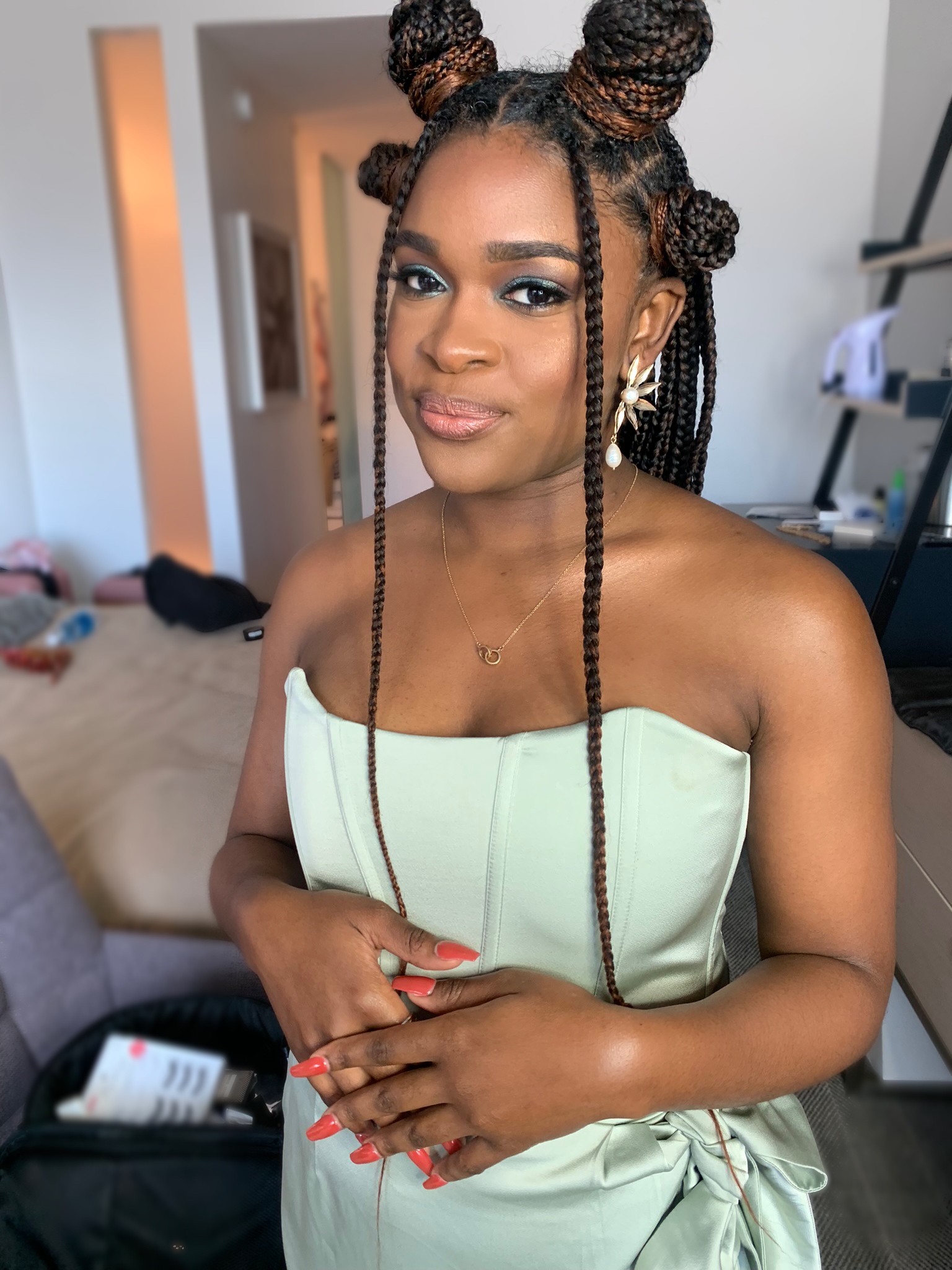 Portrait in a pale green dress with soft glamorous makeup