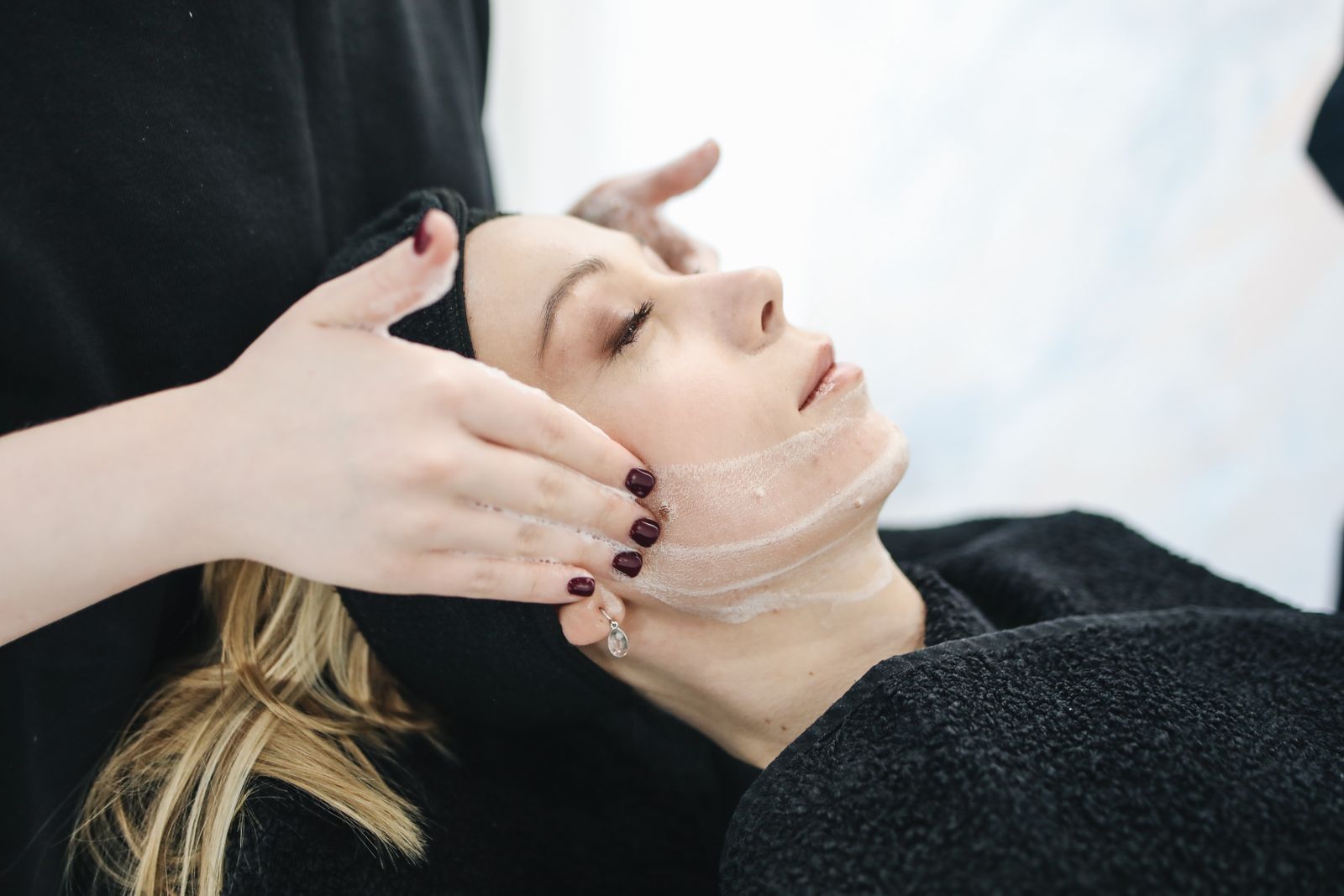 Facial treatment in a med spa after consultation intake.