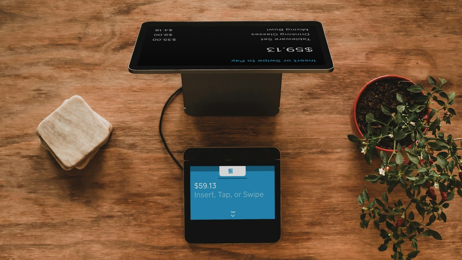 Retail counter POS showing an itemized giftware total and payment prompt — real price context, not a discount-hero graphic. Retail counter POS showing an itemized giftware total and payment prompt — real price context, not a discount-hero graphic.