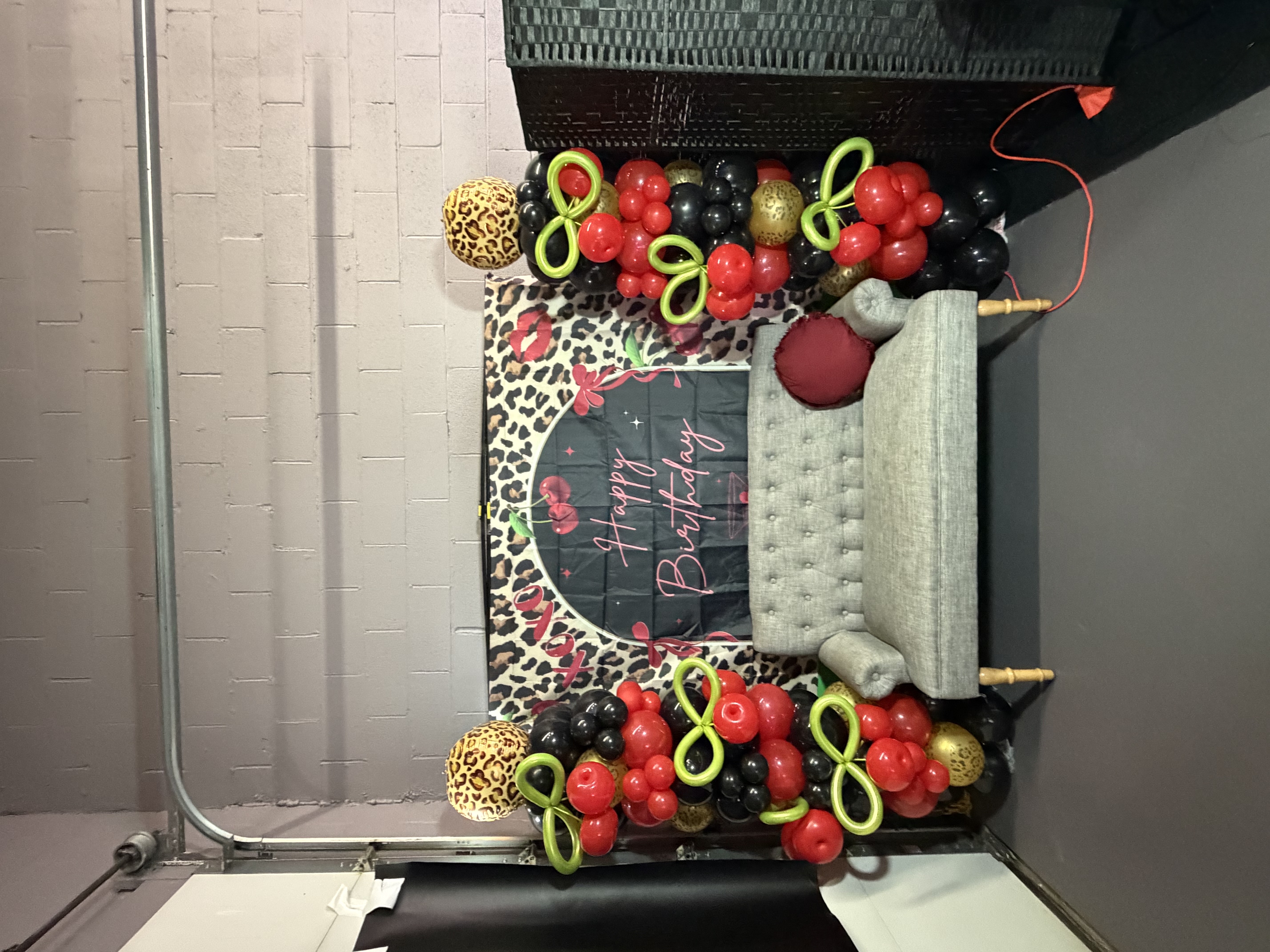 Black and gold birthday balloon setup
