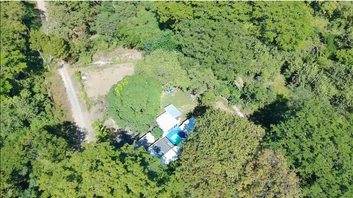 Aerial view of all four homes and pool
