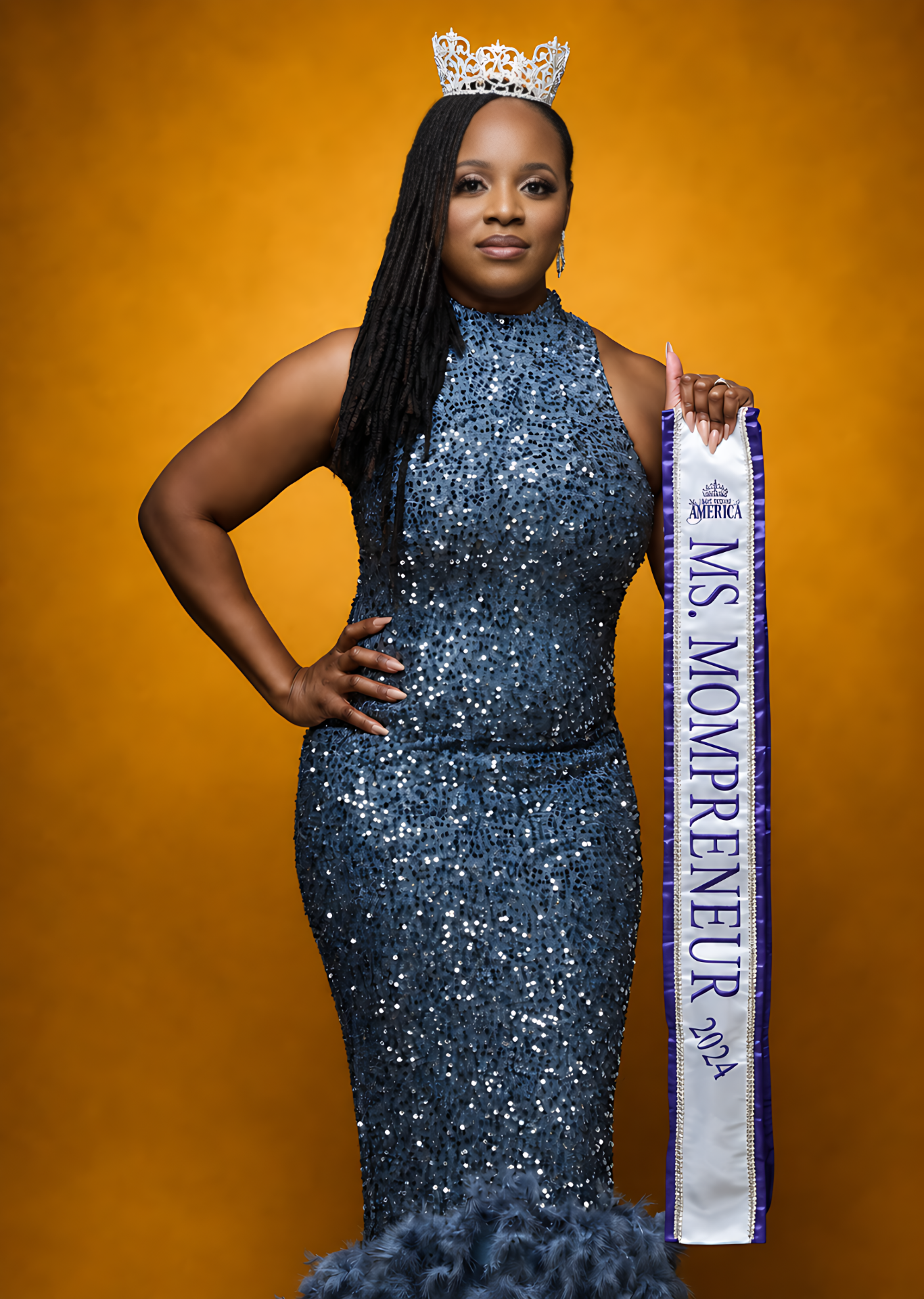 Ms. Mompreneur titleholder in crown and sash