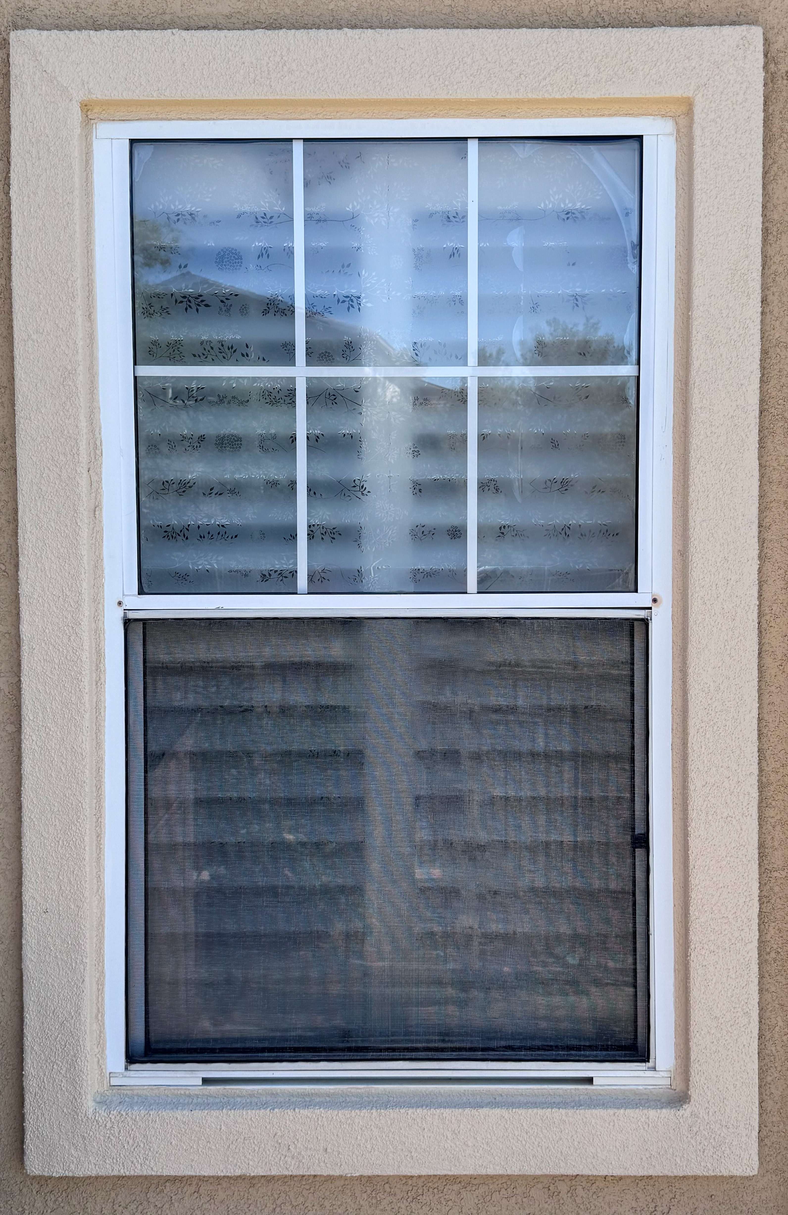 Original aluminum window before replacement