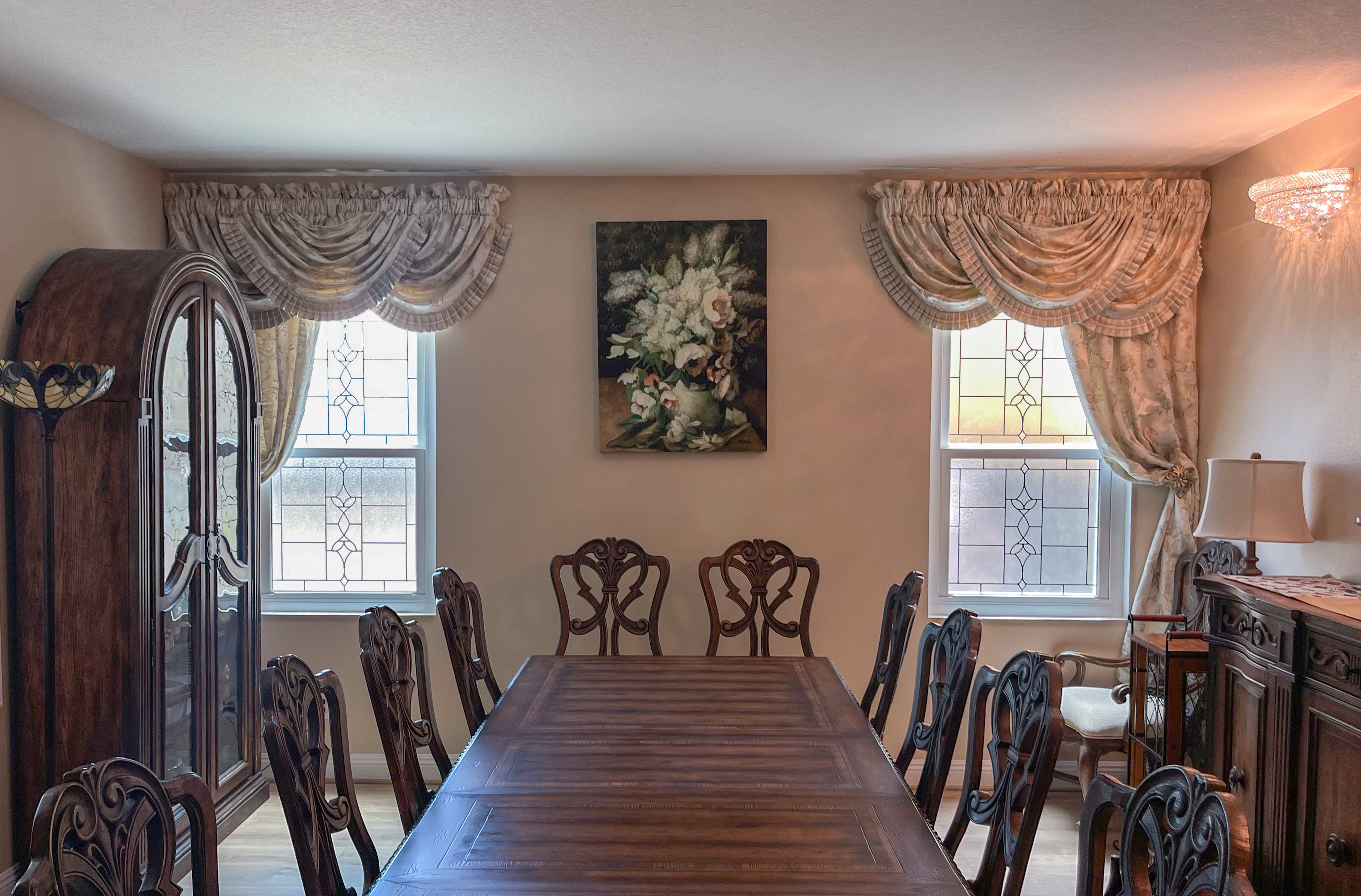 Dining room with custom art-glass double-hungs