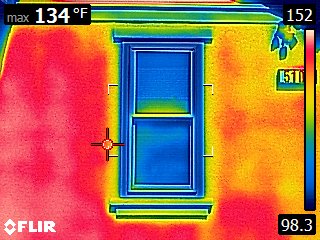 Thermal image: stucco wall reading 134 degrees, window reading 94