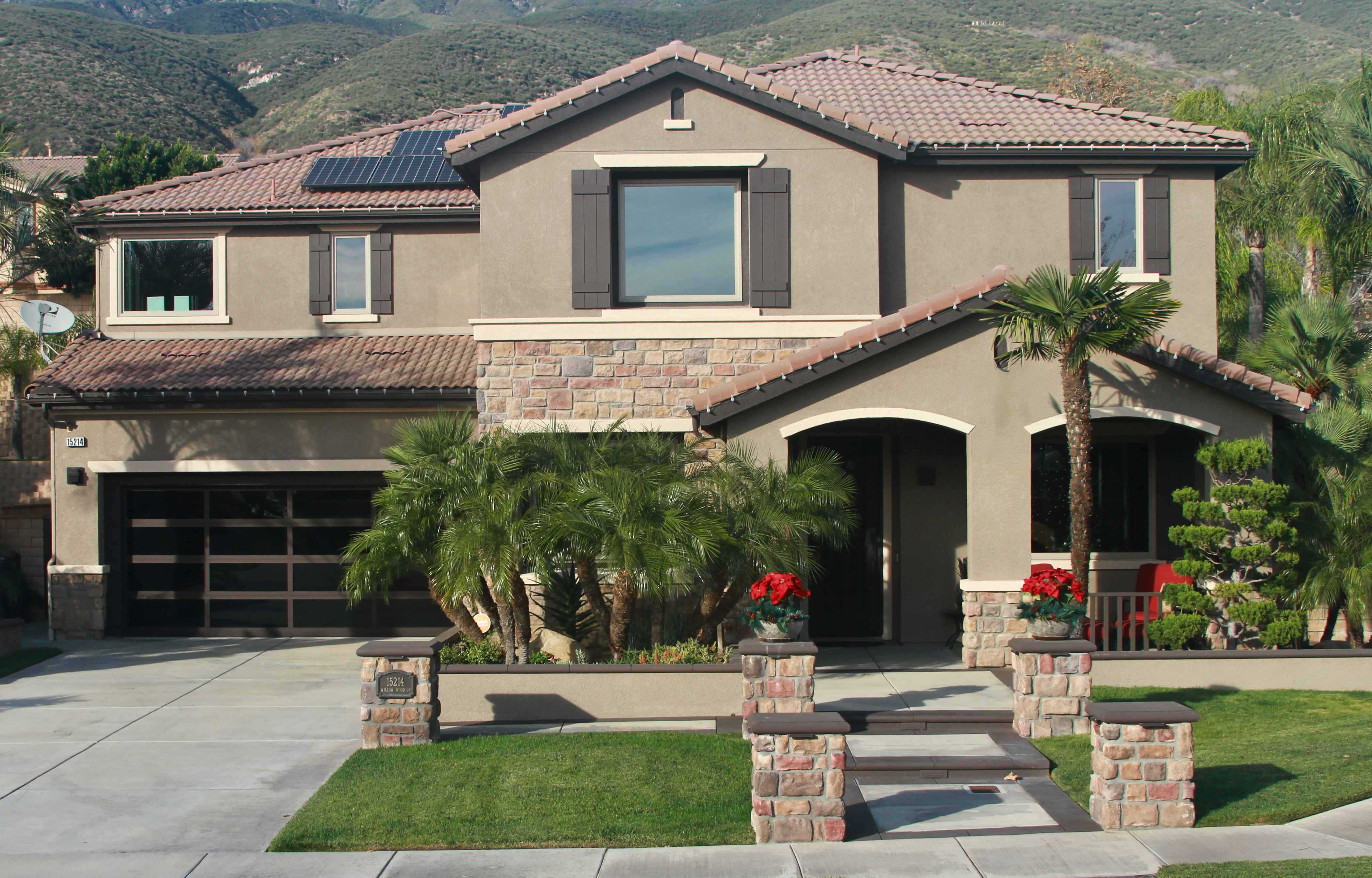 Front of a two-story home with new windows
