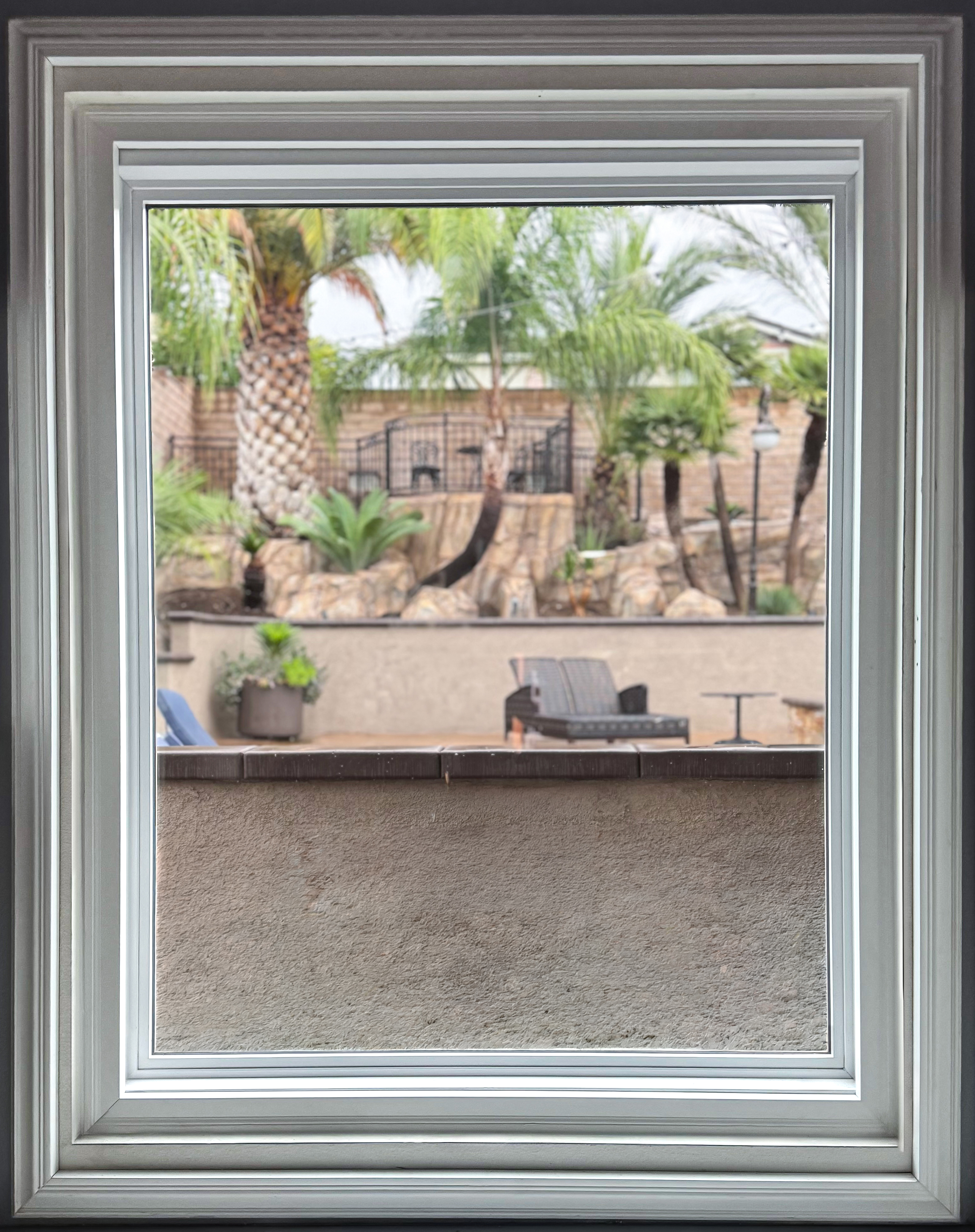 Stacked white casing around a garage window