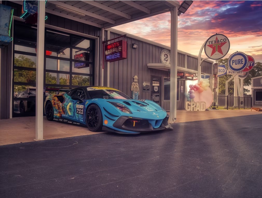 Double E Ranch venue exterior with race car and vintage Texaco signage, event space in
