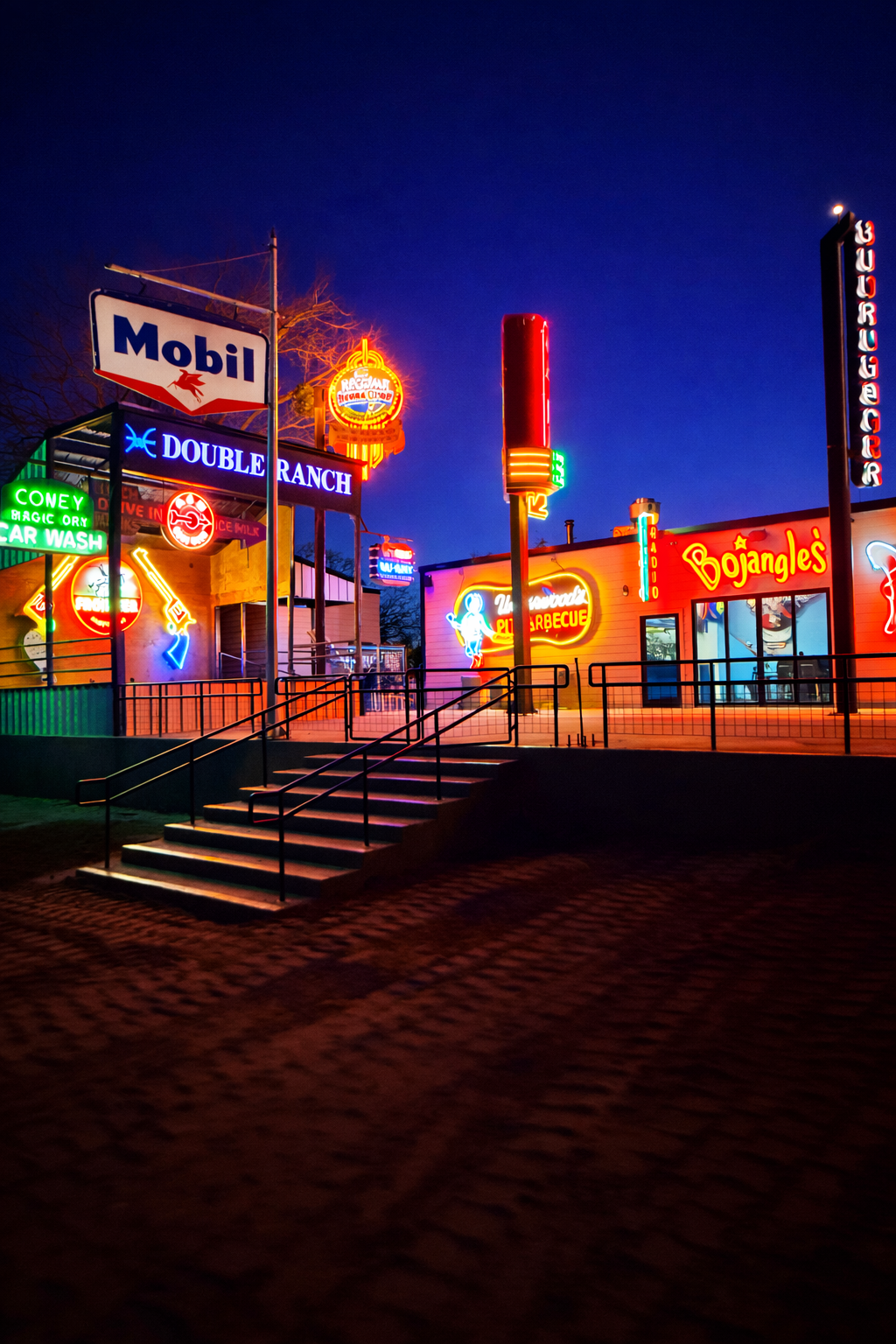 Double E Ranch & Venue illuminated sign and building exterior at night, event venue in