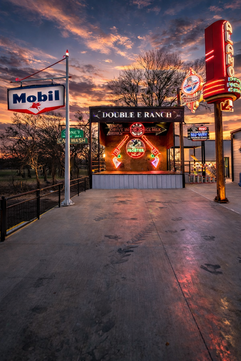 Double E Ranch & Venue exterior at sunset, illuminated vintage signs and building, event venue