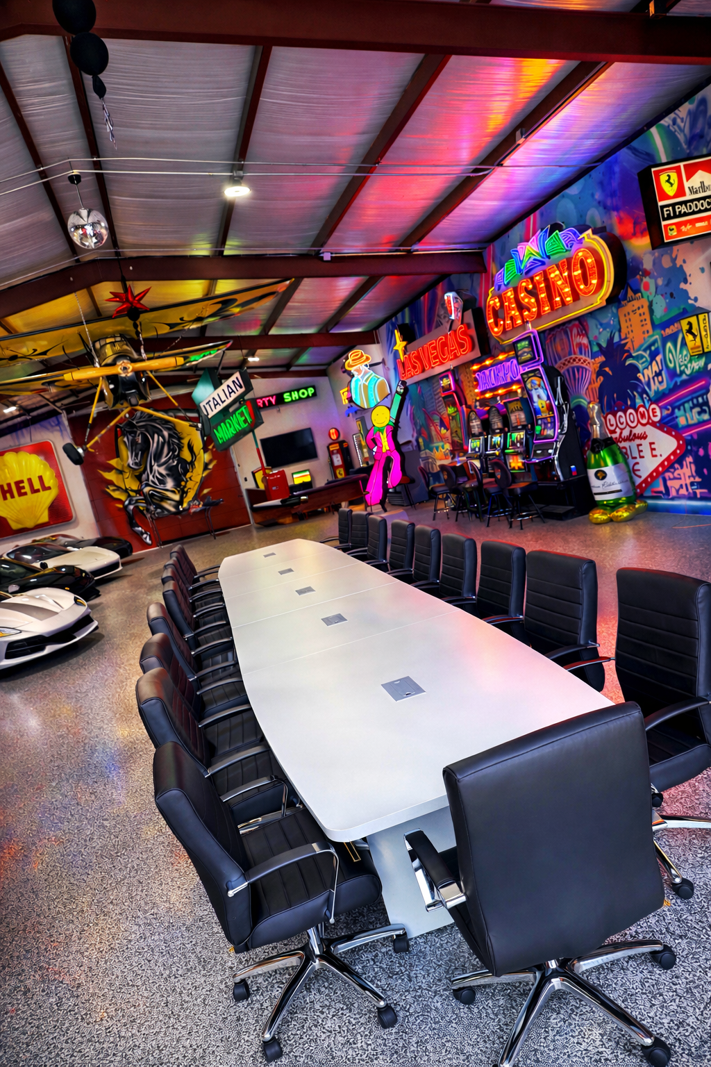 Double E Ranch Ferrari Room: climate-controlled event space with long table and chairs, decorated with