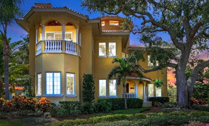 Mediterranean-style villa exterior painting at sunset, Sarasota FL