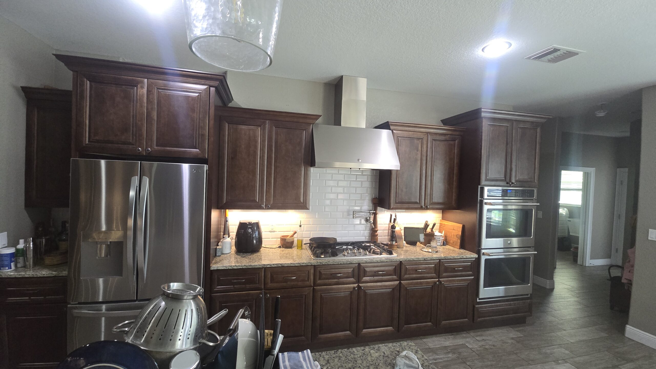 Kitchen with dark wood cabinets, interior painting Bradenton