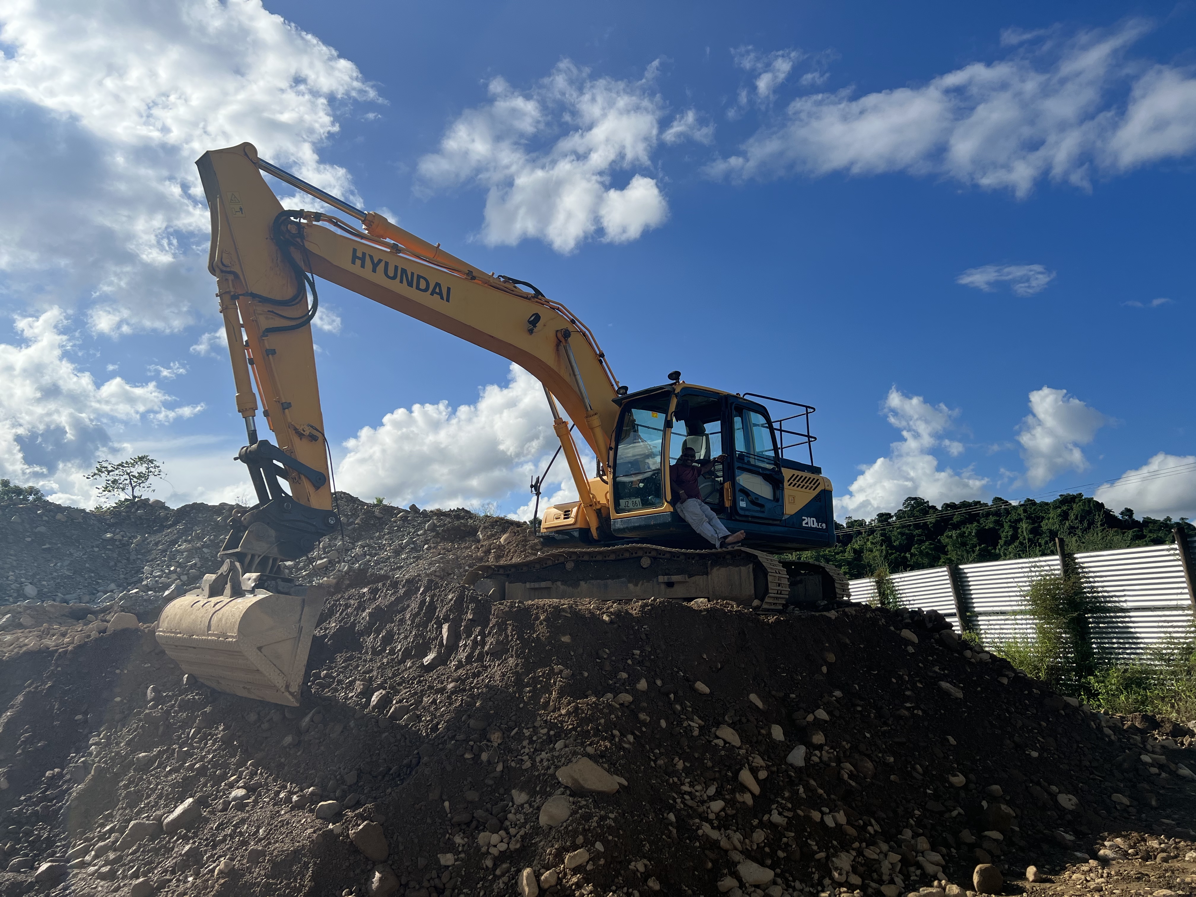 Excavator at Naqali quarry