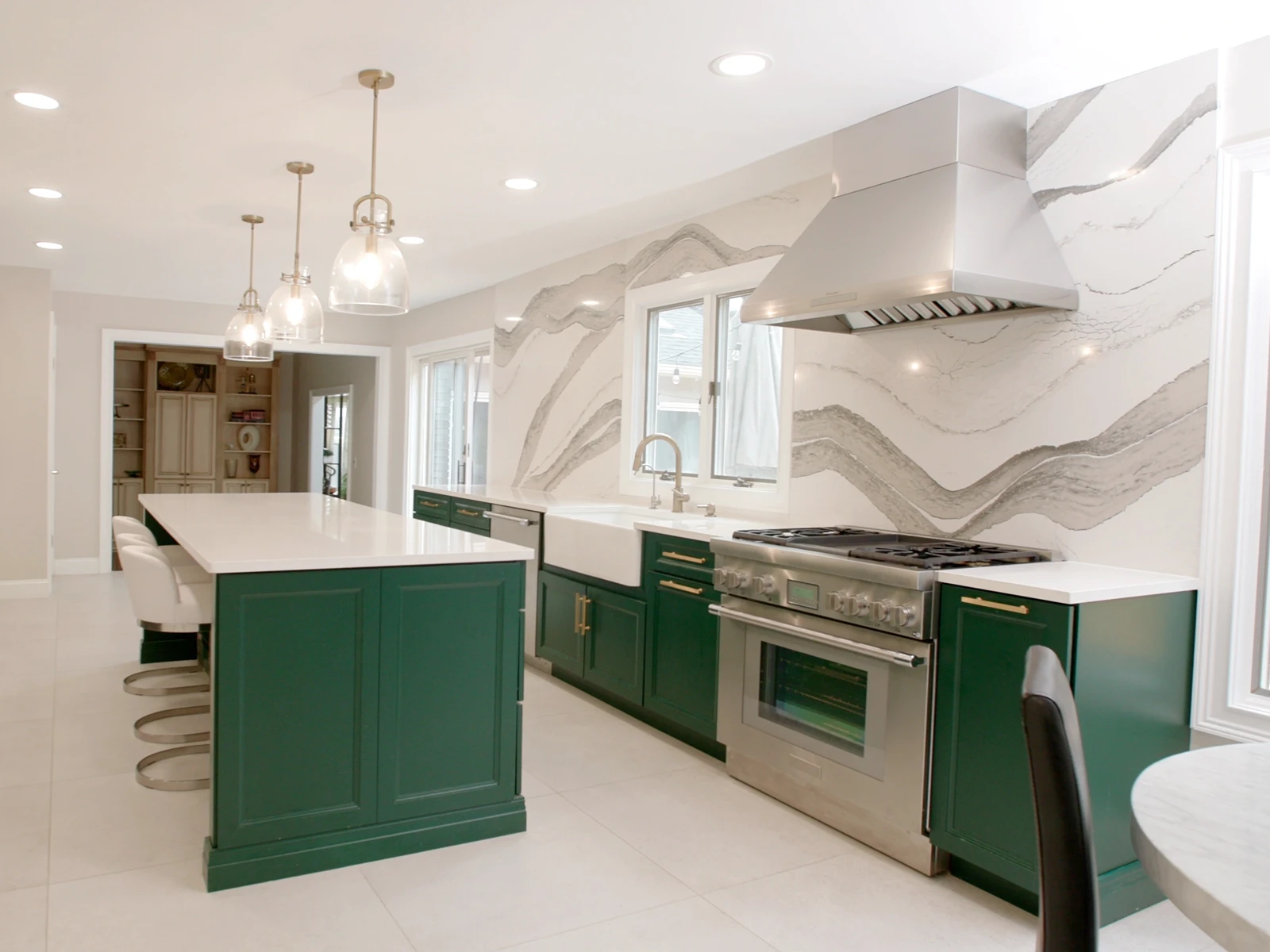 East Brunswick kitchen with Royal Green painted cabinets and a Cambria slab wall, after