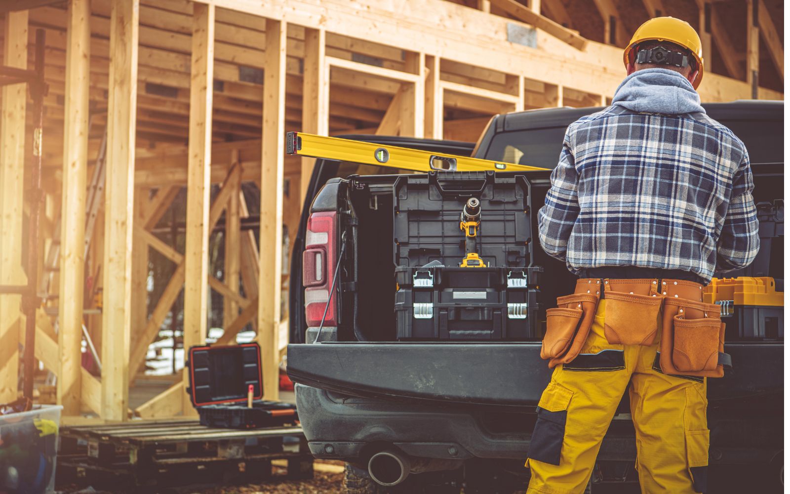 Contractor reviewing plans at a job site