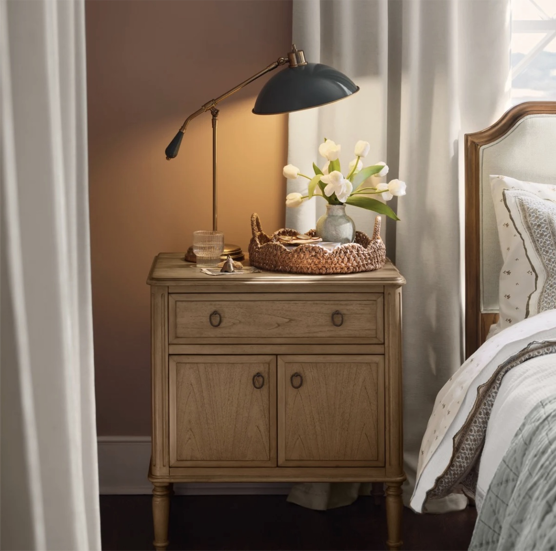 Magnolia lamp on night table