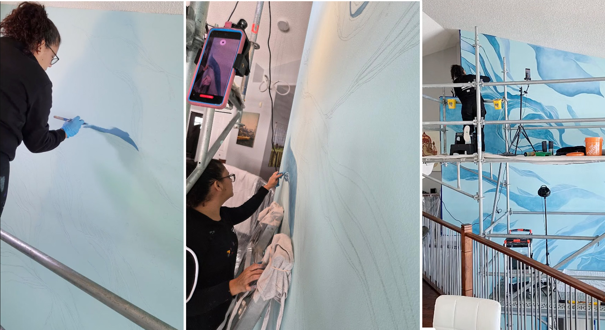 A three-panel collage showing an artist using a brush to block in the first dark blue paint layers, a vertical perspective of the pencil lines being painted with a phone mounted to the scaffolding, and a wide view of the first flowing gradients taking shape on the wall. A three-panel collage showing an artist using a brush to block in the first dark blue paint layers, a vertical perspective of the pencil lines being painted with a phone mounted to the scaffolding, and a wide view of the first flowing gradients taking shape on the wall.