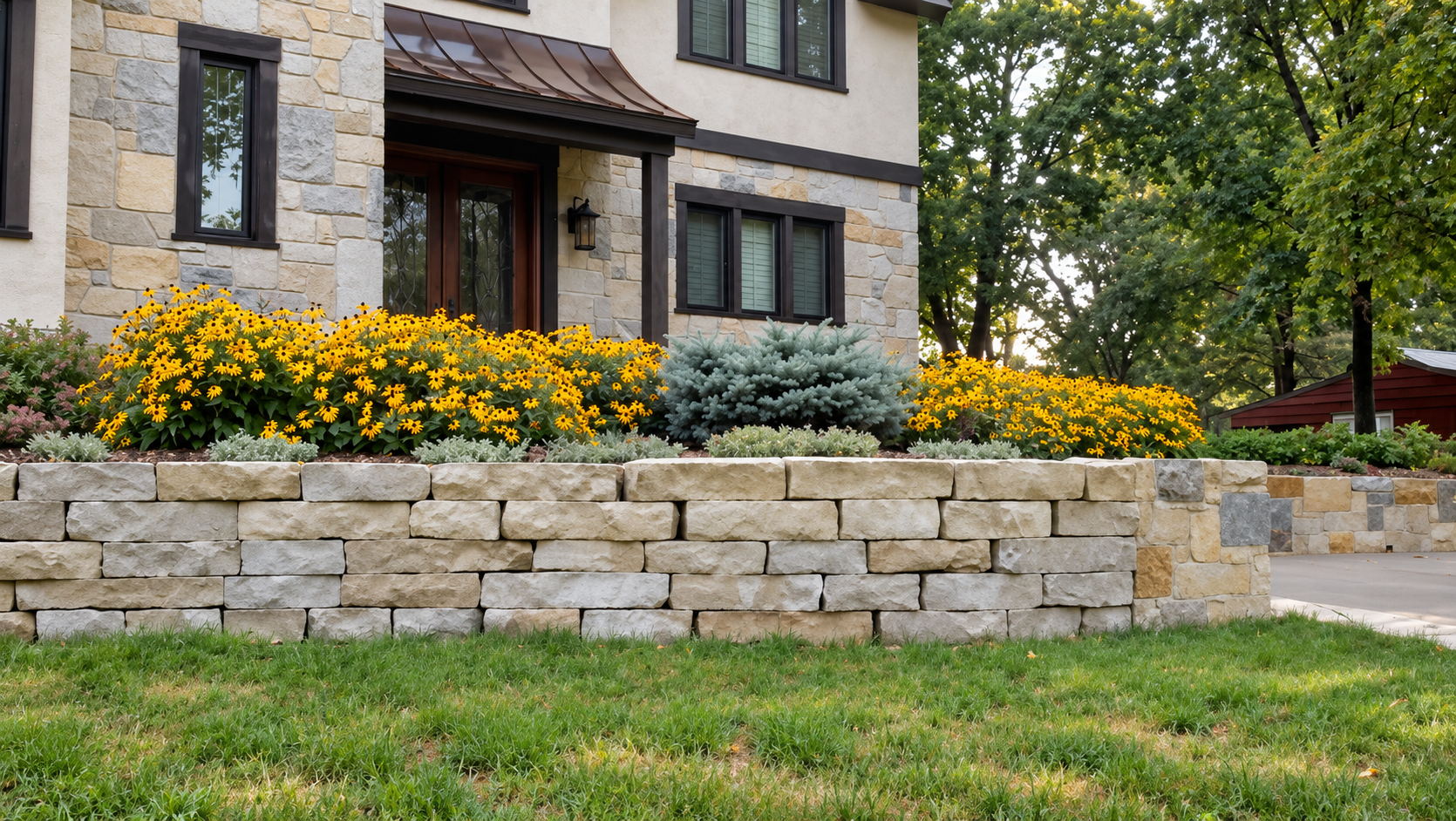 Paver patio with a circular fire pit, stone retaining walls and landscape plantings